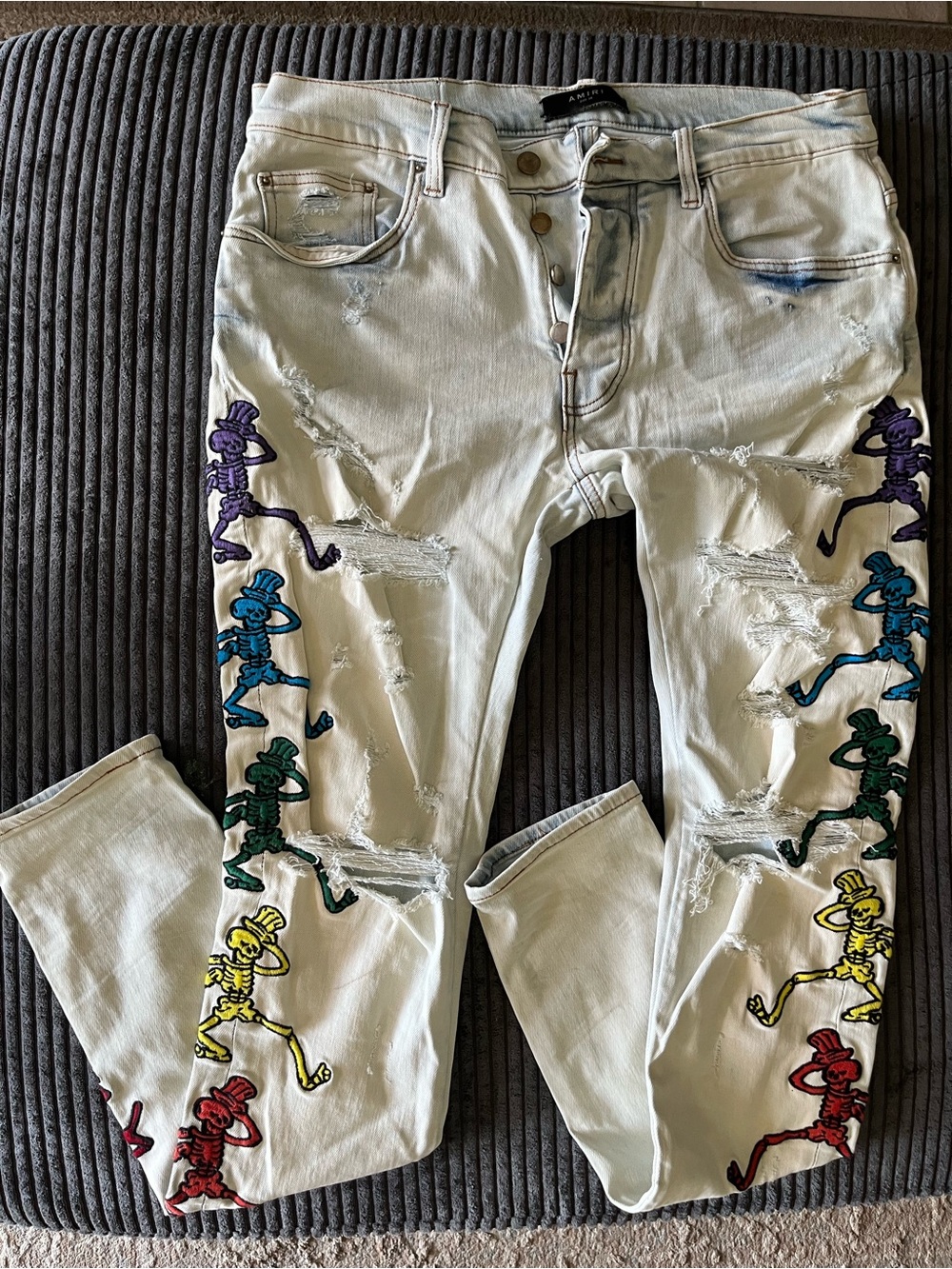 AMIRI White Skinny Jeans with Multicolor Skeleton Embroidery
